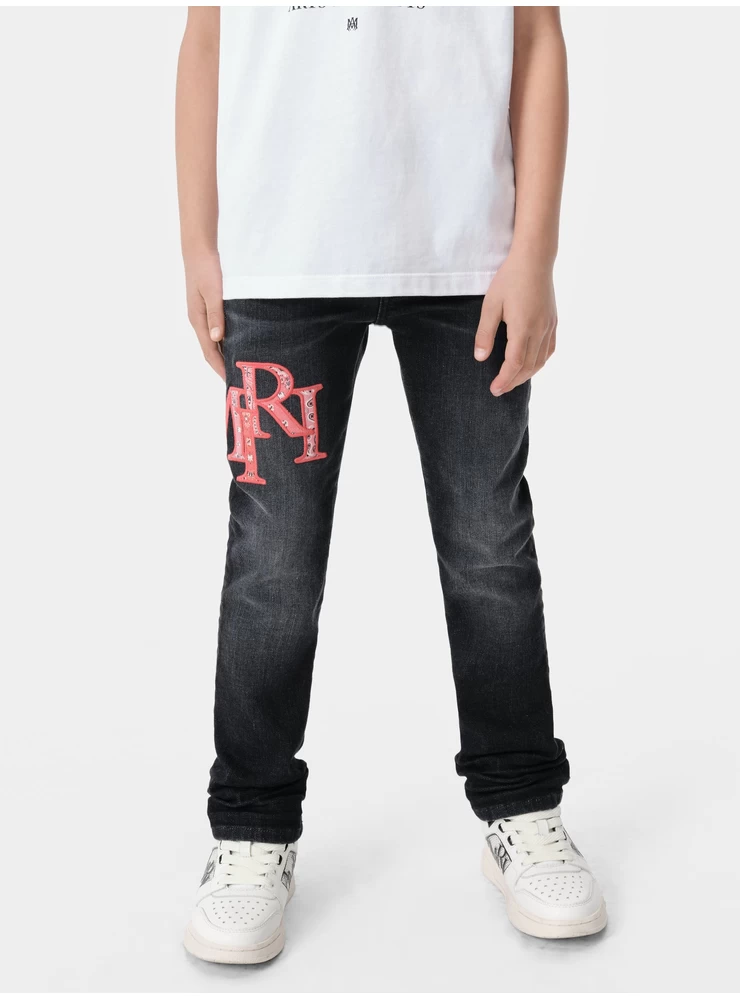 Amiri KIDS - KIDS' BANDANA STAGGERED LOGO JEAN - Faded Black