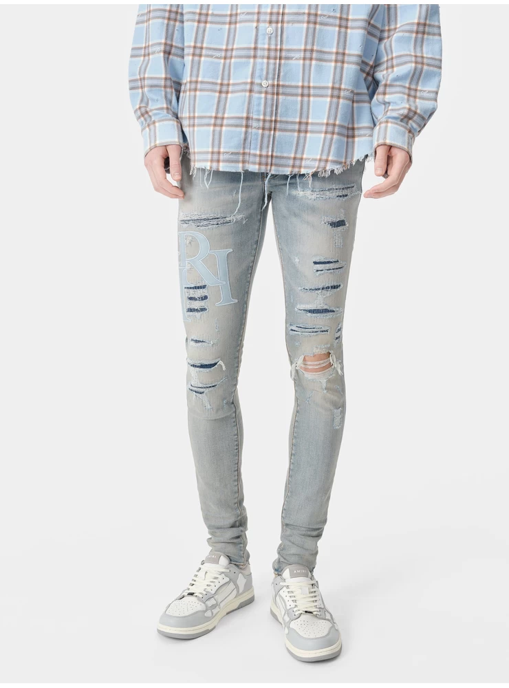 Amiri STAGGERED LOGO JEAN - Clay Indigo
