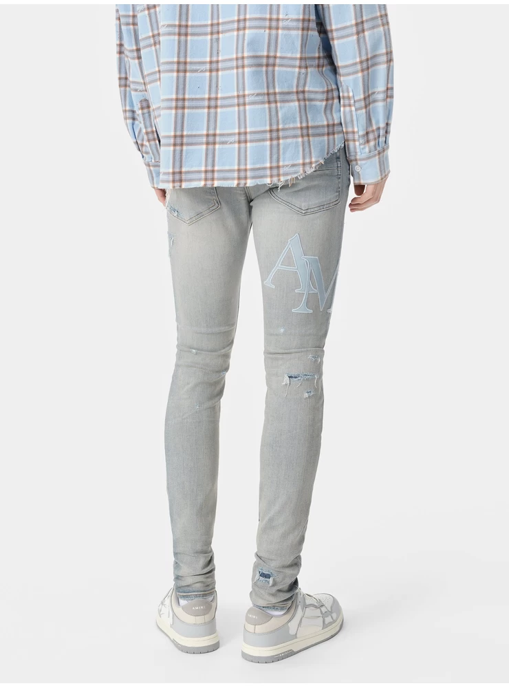 Amiri STAGGERED LOGO JEAN - Clay Indigo