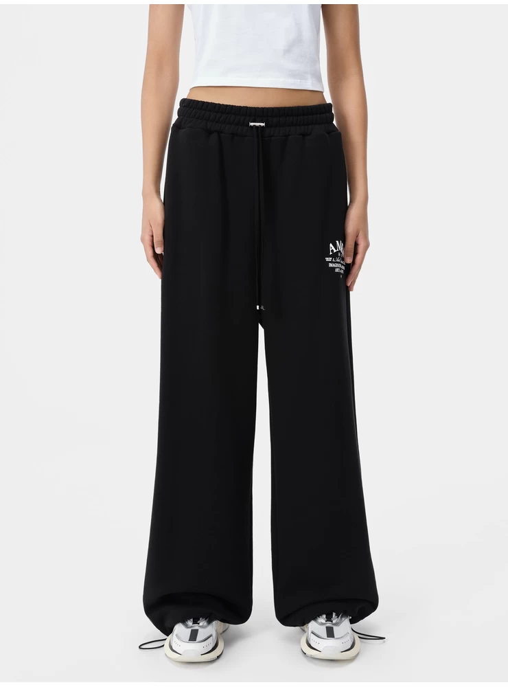 Amiri WOMEN - WOMEN'S ARTS DISTRICT FLARE SWEATPANT - Black